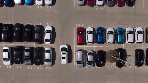 Cars driving on huge parking lot