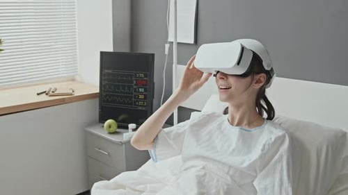 Woman in Hospital Looking Through VR Helmet