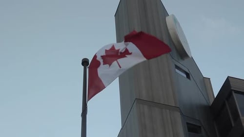 Canadian Flag Waving by Modern Architecture