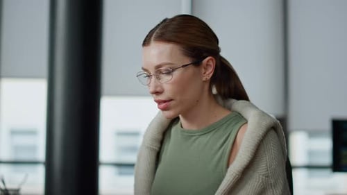 Focused Woman Working in a Modern Office