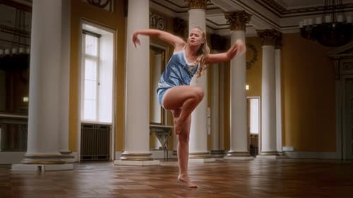 Young Girl In Blue Nightdress Dancing Expressively In Grand Dance Hall