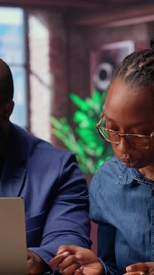 African American Couple Discusses Mortgage and Insurance Payments at Home