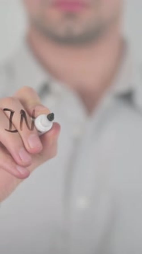 Man Writes Increase Wages on Glass Surface