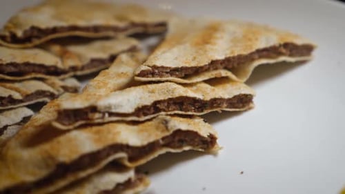Close Up of Lebanese Grilled Beef Pitas With Salad in Slow Motion