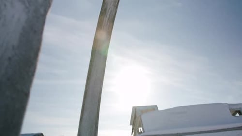 Tilt up from winterized boat to Whale Bones arch at Utqiagvik Barrow Alaska North Slope in the Arcti