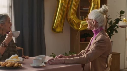 Seniors Celebrate Birthday with Cake and Tea
