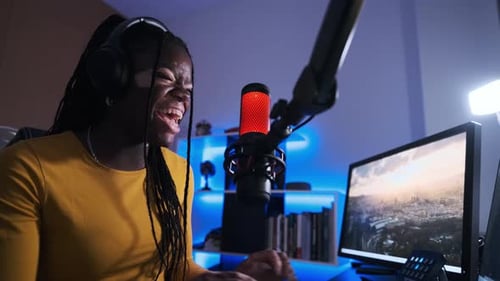 Woman with Vitiligo Celebrating While Broadcasting in a Studio