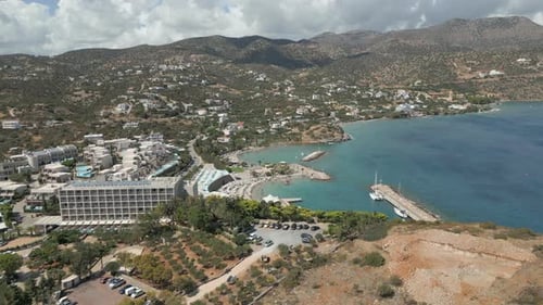 Local Resort Town On North Coast Of Crete Greece Drone Track Right 4K 60FPS