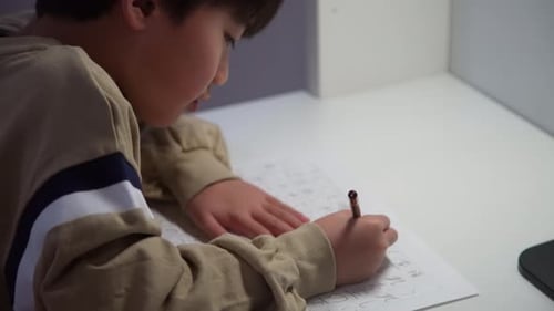 A boy practicing calligraphy
