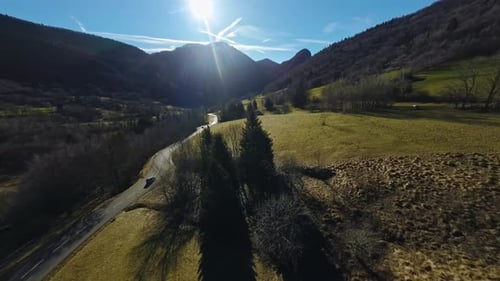 Aerial view of a mountain road with cars