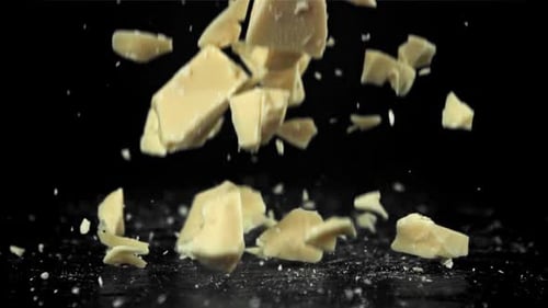 Chunks of White Chocolate Fall on the Table Filmed on a Highspeed Camera at 1000 Fps
