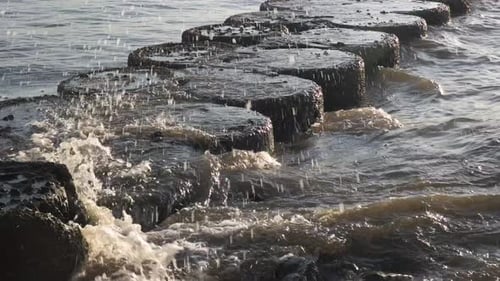 the beach barrier that was hit by the sea waves
