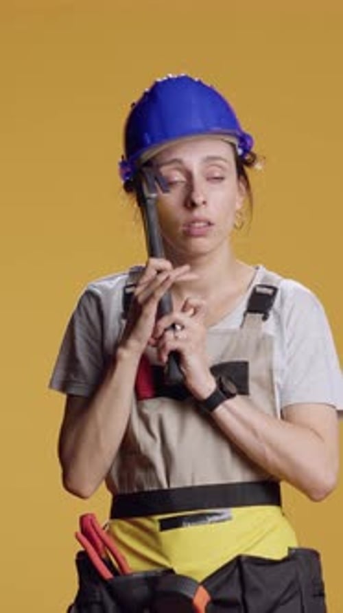 Vertical Video Portrait of Powerful Female Builder Having Headache
