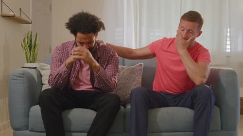 Engaging in a Supportive Conversation Between Close Friends Within a Cozy Living Room Setting