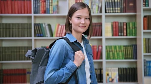 Female University Student with Backpack Inside Library of Educational Building