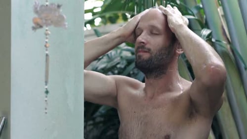 Man Washing Hair With Shampoo Outdoors in Shower