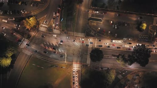 Aerial View of a City Intersection at Night With Traffic Flowing