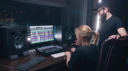 Sound Engineer and Producer Create Song in Recording Room