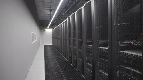 Wires Intertwine Across System Panels Behind Mesh Doors