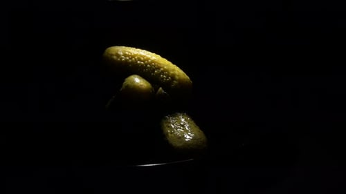 Pickles Illuminated in a Dark Setting