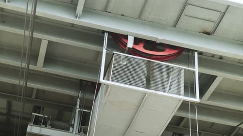 Close-up of wheels with steel cables, part of the cable car mechanism