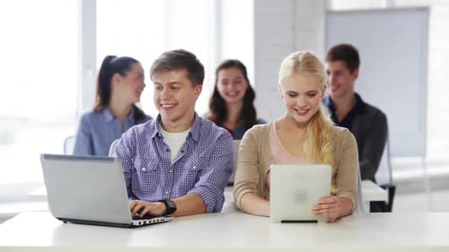 Education, New Technology and School Concept - Students in Computer Class Advice