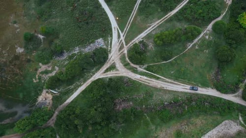 Peaceful Rural Landscape Featuring Road And Distant Shoreline
