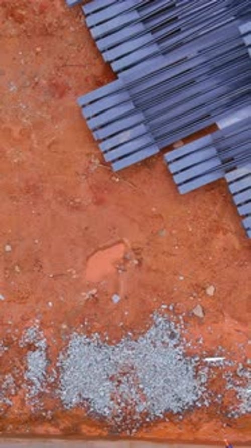 Construction Site with Materials and Debris on the Ground in a Developing Area