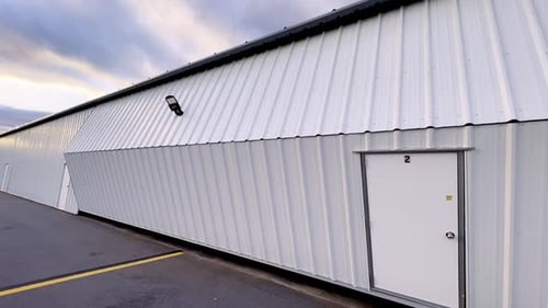 hangar door is closed with piper cherokee 180 safe inside