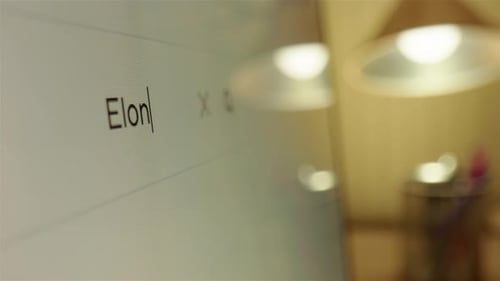 Typing Elon Musk in internet browser search engine to see what results pop up