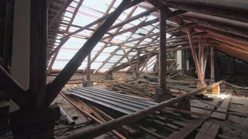 Attic of Old Building with Partly Disassembled Roof