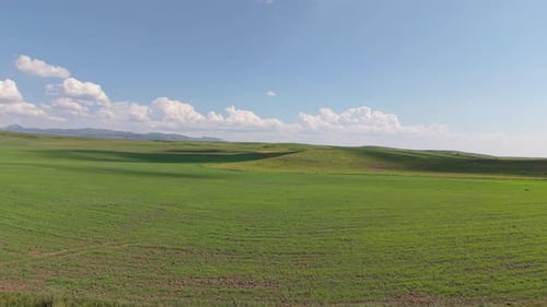 Clouds Passing Over Green Hills and Fields