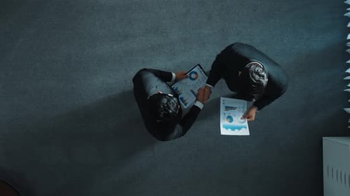 Top view of smart manager walking to shake hand and receive paper. Directorate.