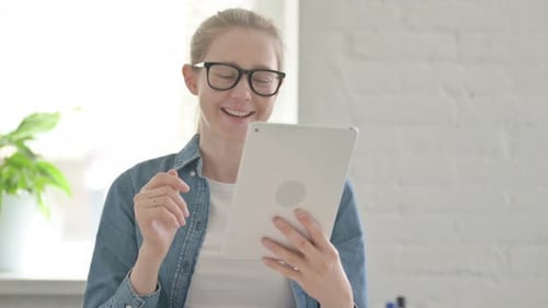 Woman Using Tablet for Video Call Indoors