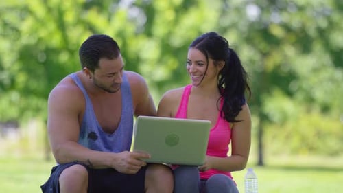 Athletic Couple at Park Use Laptop Computer Active