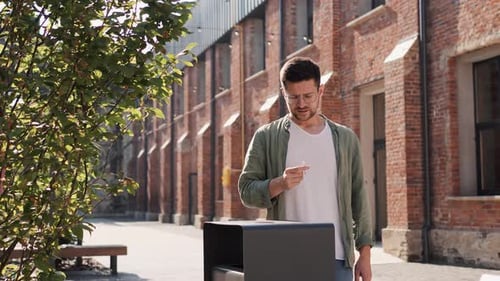 Pensive Healthy Bearded Man in Casual Outfit Breaks a Cigarette Quits Smoking