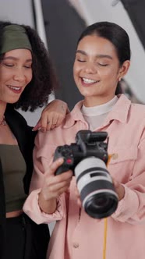 Smiling Young Women Looking at Camera in Studio
