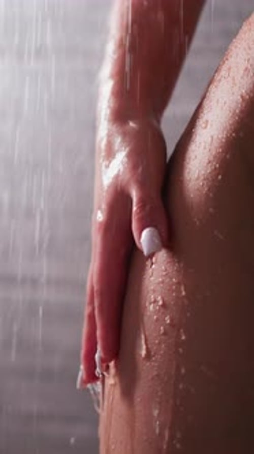 Elegant Woman Under Shower Stream