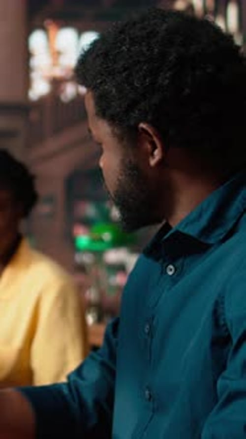 Vertical Video Black College Students Comparing Their Class Notes at the University Library
