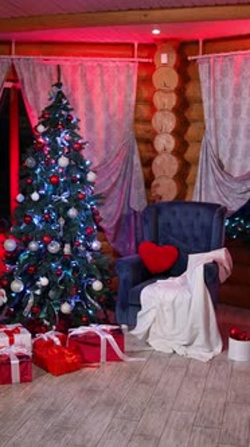 Cozy room with a Christmas atmosphere. Comfortable home environment with Christmas tree and gifts