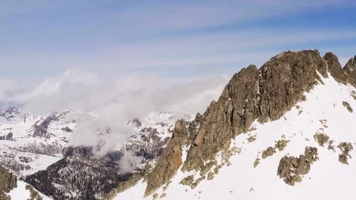 Aerial panoramic view of breathtaking Dolomite mountains covered with snow. Italy
