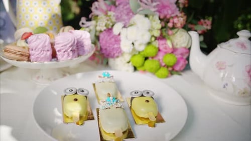 Composition with flowers, macaroons sweets desert and coffee and tea