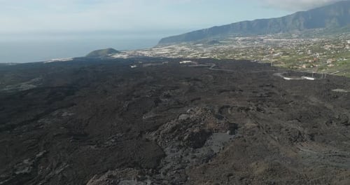 Dark basalt rock field from new volcanic eruption on La Palma island