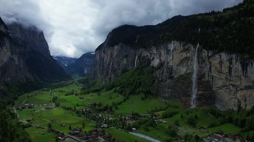 4k Drone Aerial Pan Of Famous Staubbach Waterfall In Lauterbrunnen Village With Impressive Glacial V