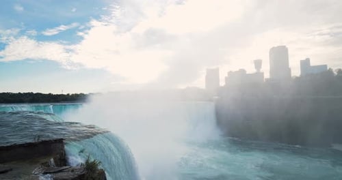 Edge of Niagara Falls Waterfall, Water Cascading Aerial View Above