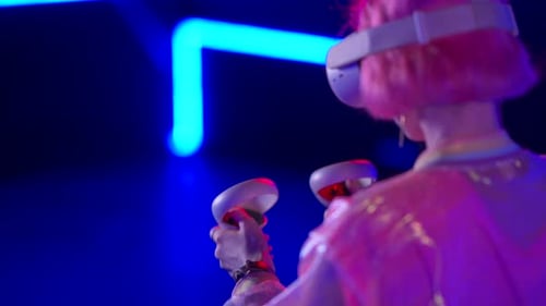 Woman Using Virtual Reality Headset with Controllers