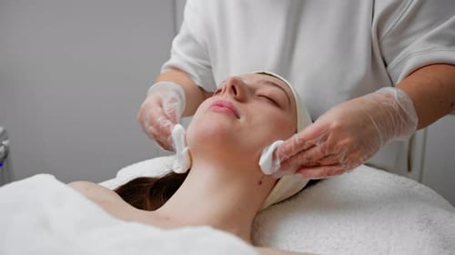 face skin facial rejuvenation cosmetic procedure Woman patient in cosmetology clinic doctor