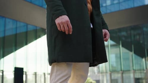 Man Standing Outside a Modern Building