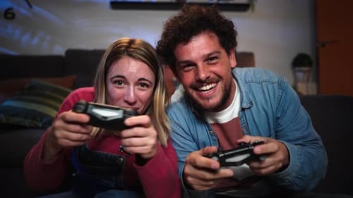 Couple Playing Video Games in Living Room at Night
