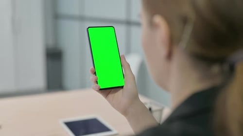 Businesswoman Using Smartphone with Green Screen